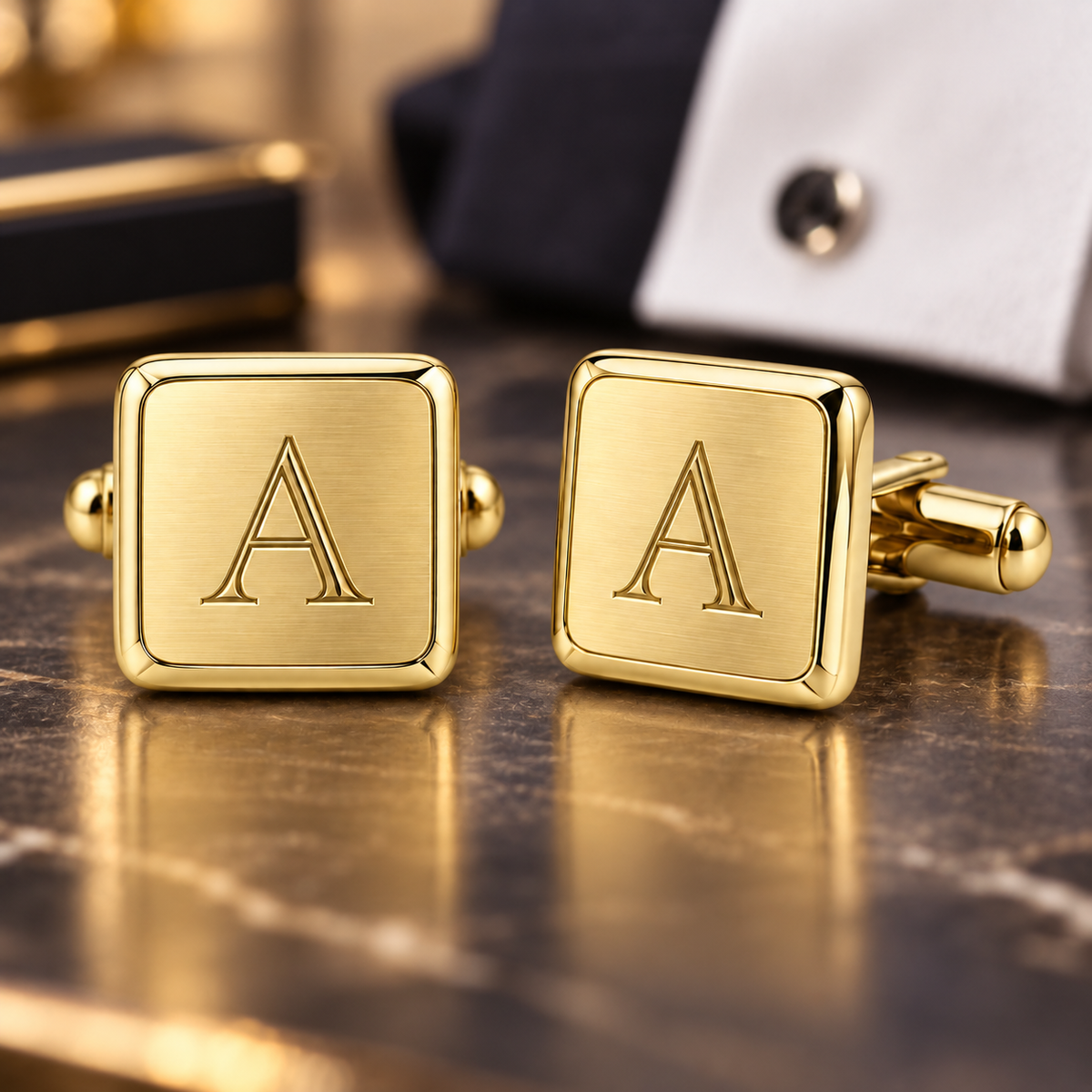 Pair of square gold-tone cufflinks with engraved letter A monograms and rounded corners