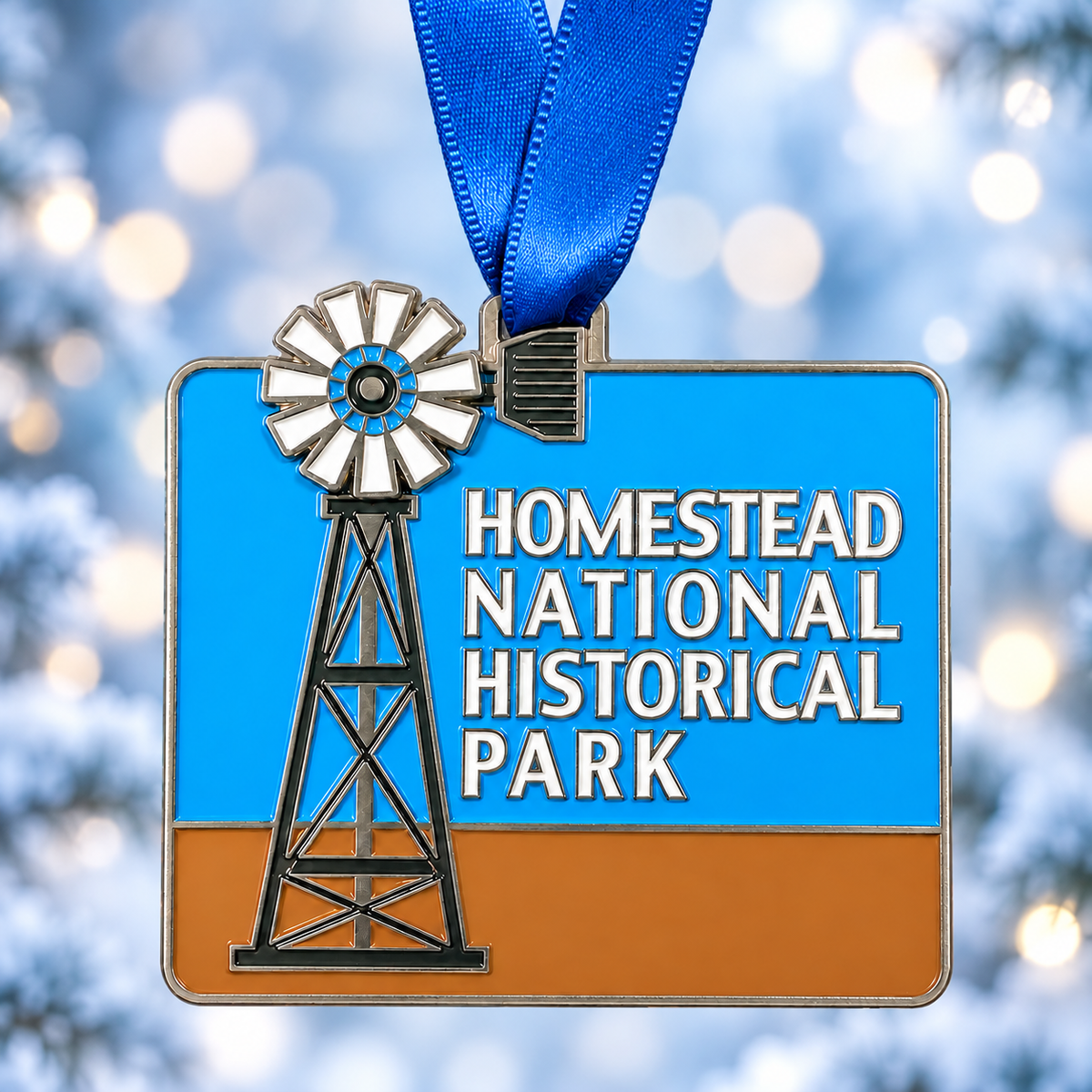 Rectangular Homestead National Historical Park ornament with a windmill, blue sky, and blue hanging ribbon