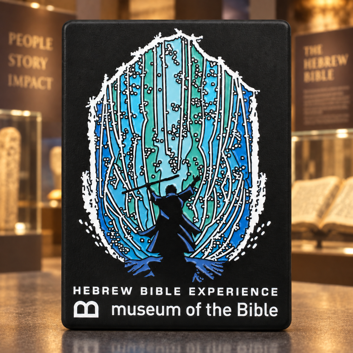 Black Museum of the Bible magnet with a blue and turquoise branching design and Hebrew Bible Experience lettering