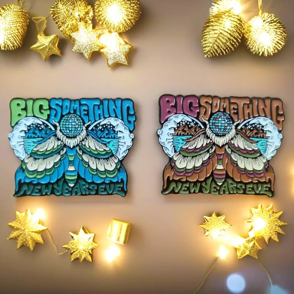 New Year party-themed custom pins featuring “Big Something” band elements, with vibrant designs suitable for celebrations and band merchandise.