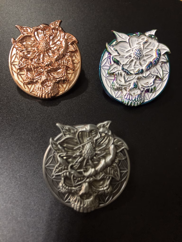 Various metal plating styles for custom lapel pins shown in one image